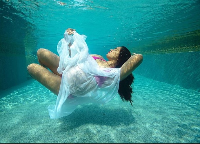 Bollywood celebrity sameera reddy underwater maternity photoshoot wearing white drape
