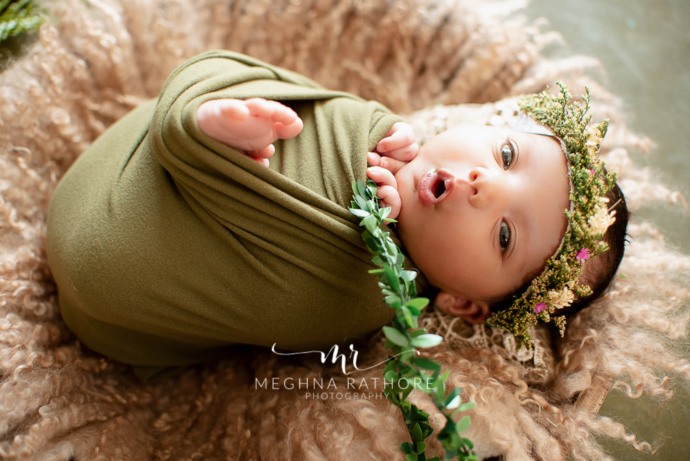 24 days old newborn girl child best indoor photo studio baby posing and smiling at meghna rathore photography in gurgaoun